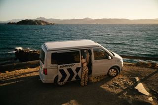 Campervan is parking in front of the sea